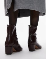leather heeled boots in burgundy