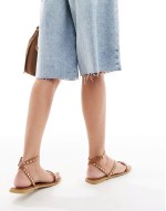 flat sandals with studded staps in tan